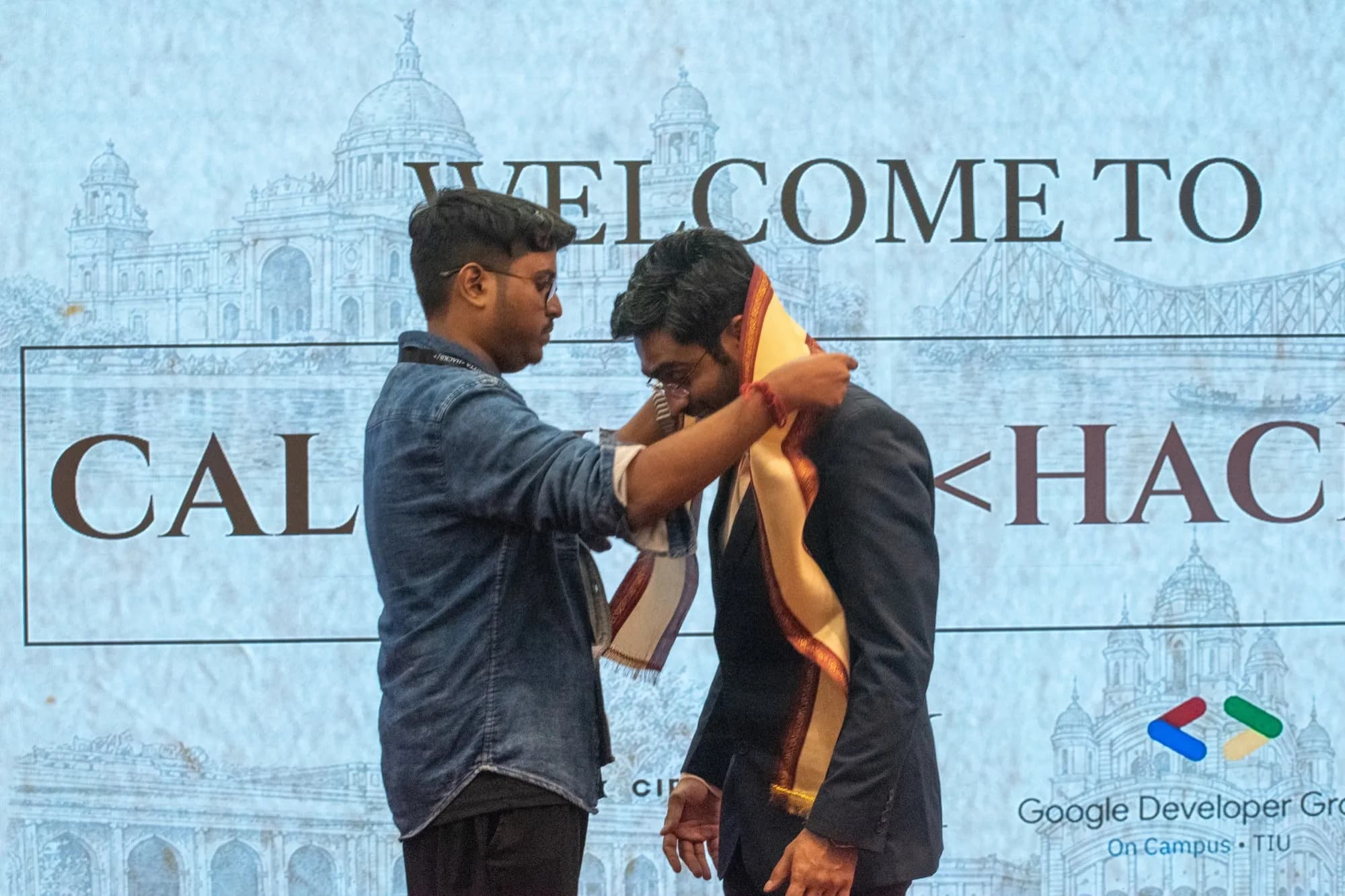 Calcutta <Hacks/>: Felicitation, with an uttariya